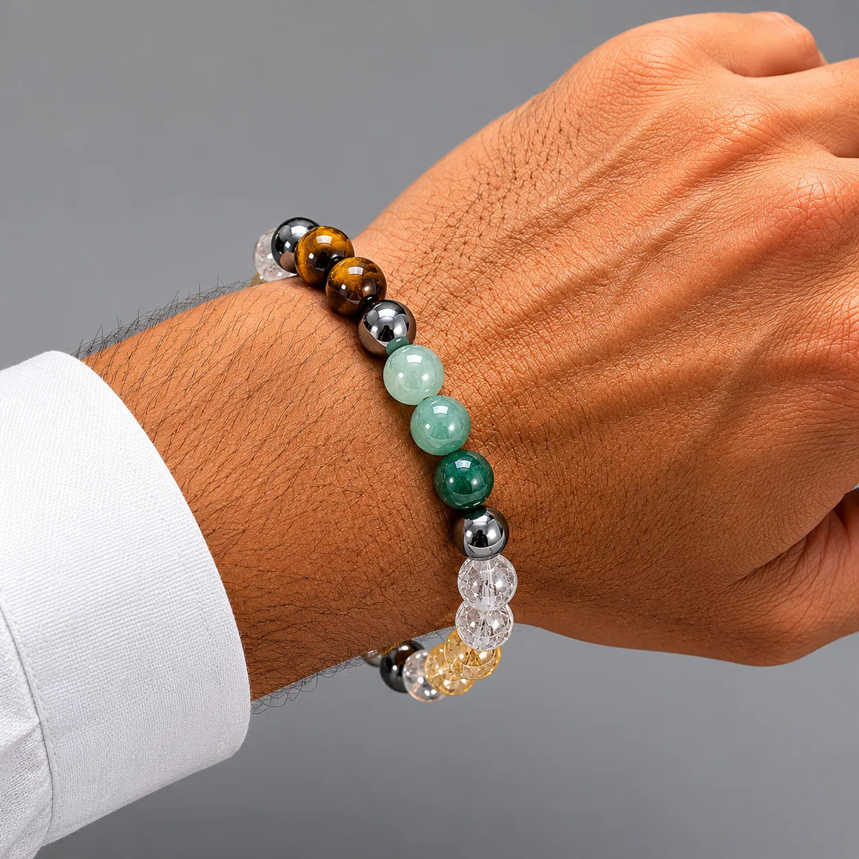 7 Chakra Healing Crystal Bracelet Berkho with natural gemstone beads, Tiger Eye stones, Clear Quartz crystals and spiritual Om design