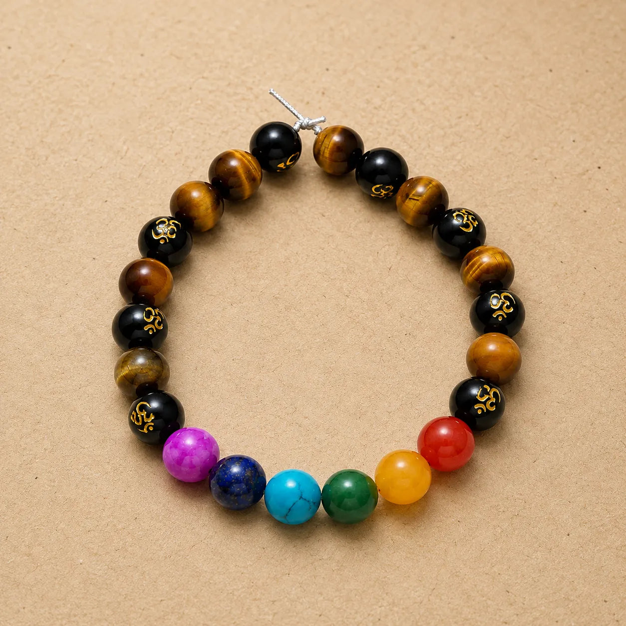 7 Chakra Tiger Eye Om Bracelet Berkho featuring natural Tiger Eye stone beads, colorful chakra gemstone beads, and Om symbol beads
